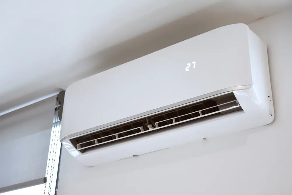 ductless heating & cooling system on bedroom wall